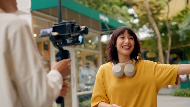 A journalist recording on location